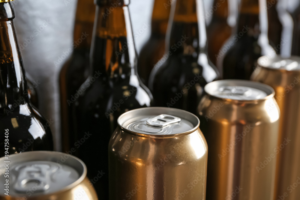 Fresh beer in cans and bottles, closeup