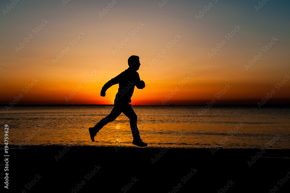 Silhouette of runner old man in the morning at the beach, sunrise Background.