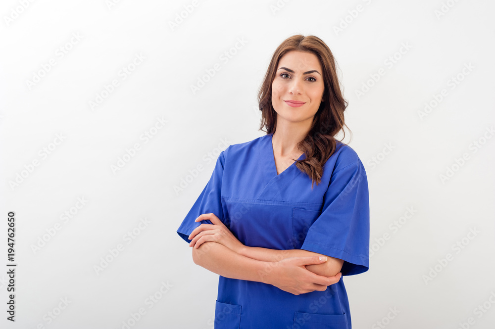 Smiling medical nurse in medical doctor uniform  isolated over white background. - obrazy, fototapety, plakaty 
