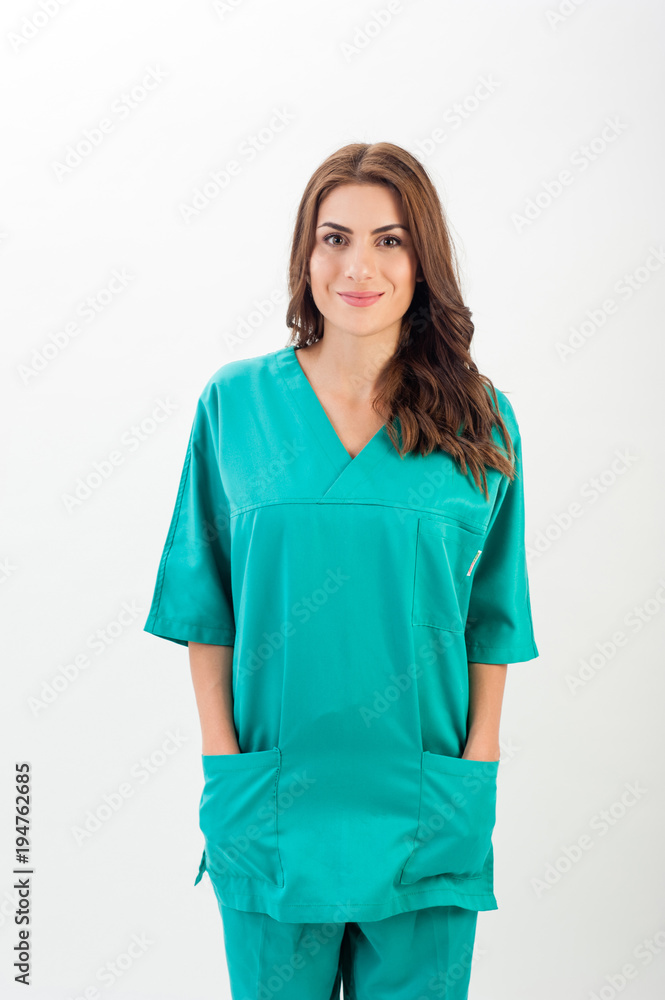 Medical nurse woman wearing blue surgery suit, standing on white background. Medical nurse woman wearing blue surgery suit, standing on white background.