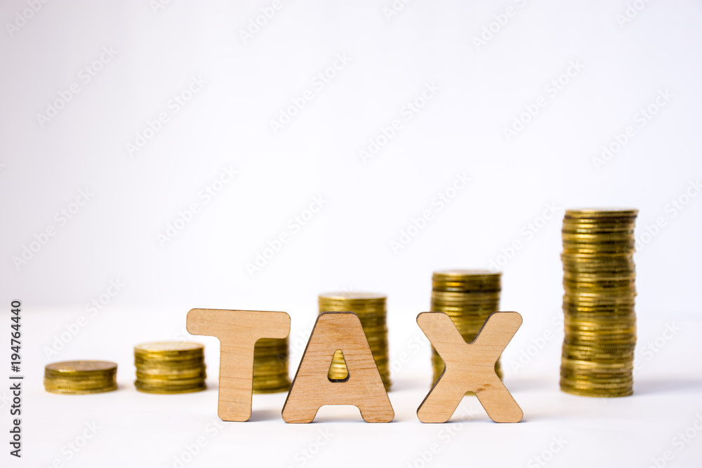 © shidlovski - Tax concept photo. Tax word from 3D volumetric letters is in foreground to background of blurred columns or stacks of coins in exit order. Visualization of tax charging and payment in business © shidlovski - Tax concept photo. Tax word from 3D volumetric letters is in foreground to background of blurred columns or stacks of coins in exit order. Visualization of tax charging and payment in business