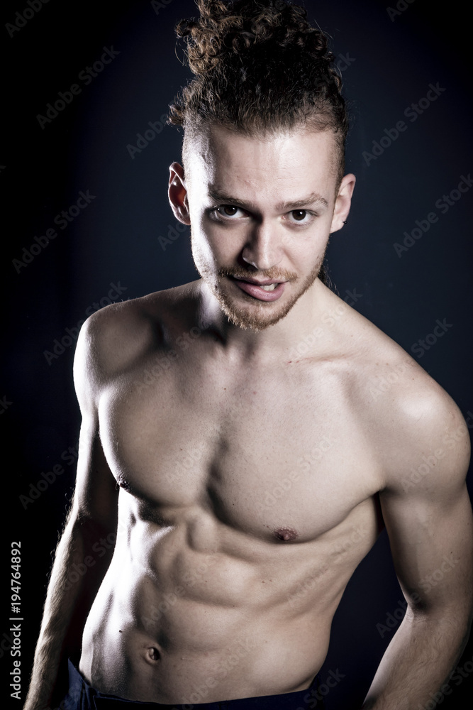 Young ginger topless man studio portrait Young ginger topless man studio portrait