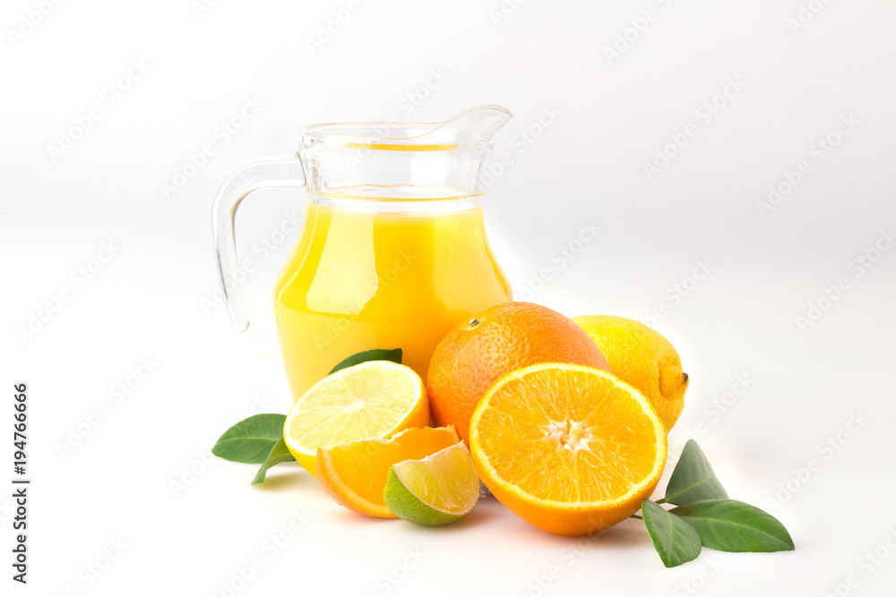 Fresh orange juice and citrus fruits lime lemon grapefruit in a jar white background healthy concept Fresh orange juice and citrus fruits lime lemon grapefruit in a jar white background healthy concept