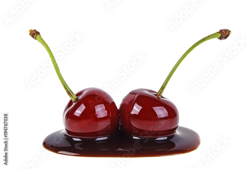 Two cherries filled with hot chocolate on a white background