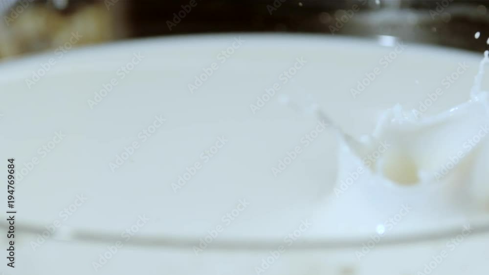 Pieces of chocolate falling into milk, Ultra Slow Motion Pieces of chocolate falling into milk, Ultra Slow Motion