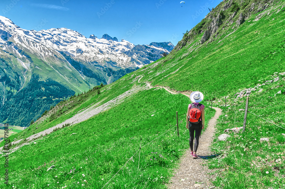 Swiss Alps. A man in a white hat, a traveler in a mountain alpine country. Landscape of the Swiss Alps, Engelberg Resort