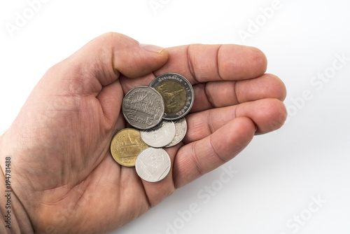 some Thai coins on a hand