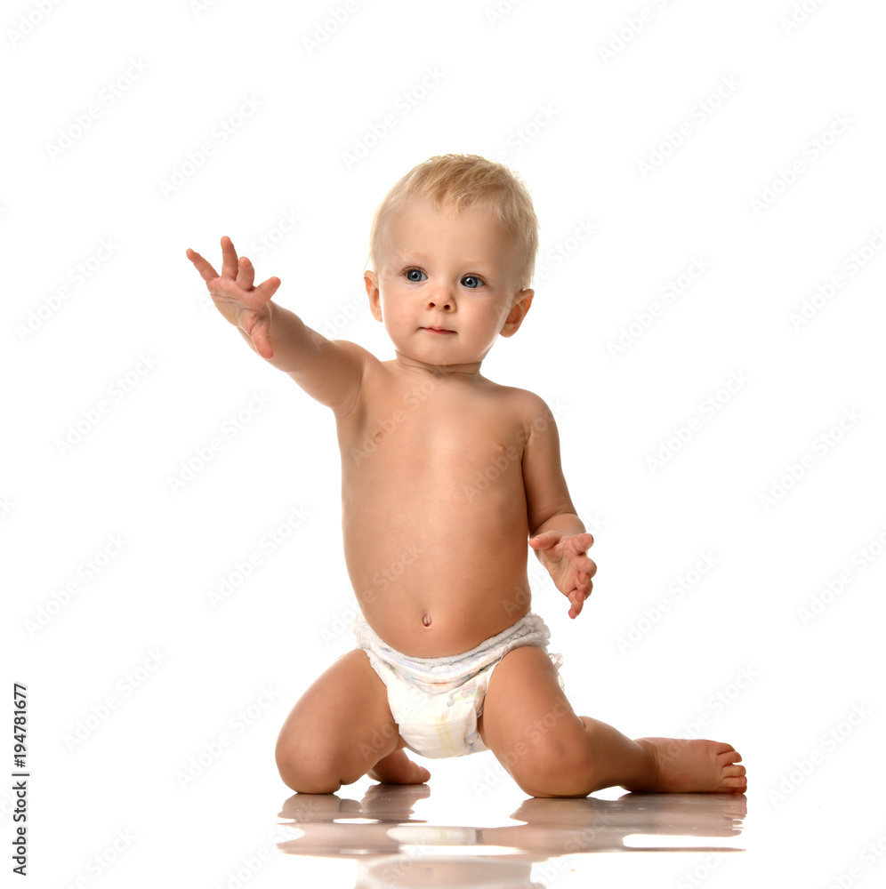 toddler boys naked Portrait of a naked toddler playing in the hamper - SuperStock