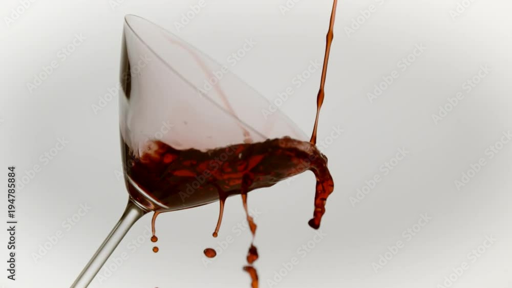 Red wine pouring out of a glass, Ultra Slow Motion Red wine pouring out of a glass, Ultra Slow Motion