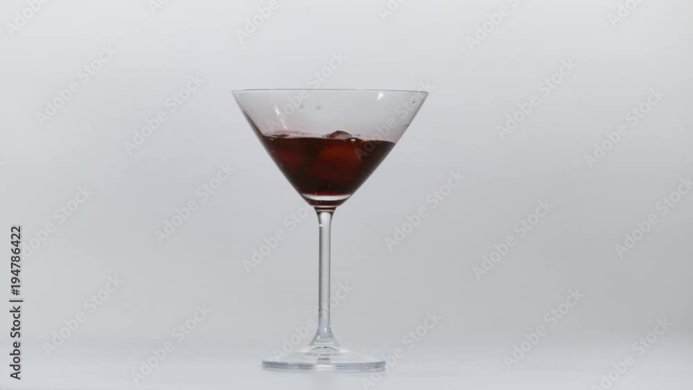 Red wine with ice cubes in a glass, Ultra Slow Motion Red wine with ice cubes in a glass, Ultra Slow Motion
