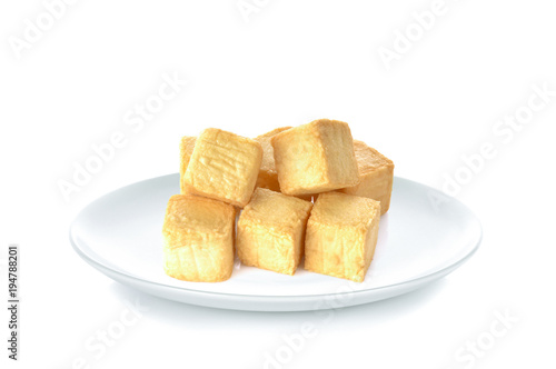 Tofu fish in white plate on white background