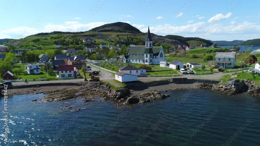 Aerial shot of people in historic trinity and the ocean coast in Newfoundland