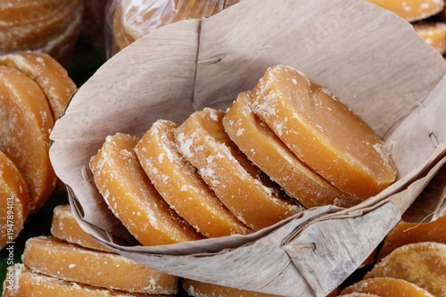 Thai traditional oganic food,  brown sugar made of cane sugar jaggery, by evaporation of the sap of sugar cane juice.