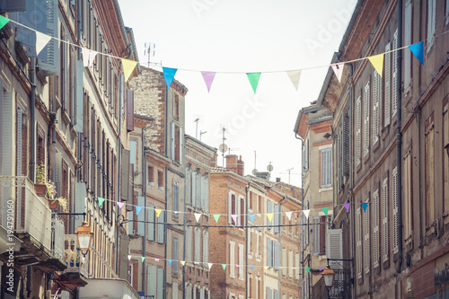 Albi city centre, Tarn, Occitanie, France - Cityscape - Traditional facades and festive garlands in the center of the old town