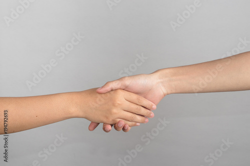 Shaking hands isolated on white background Concept of help, love, friendship, support, teamwork, couple. © charupha