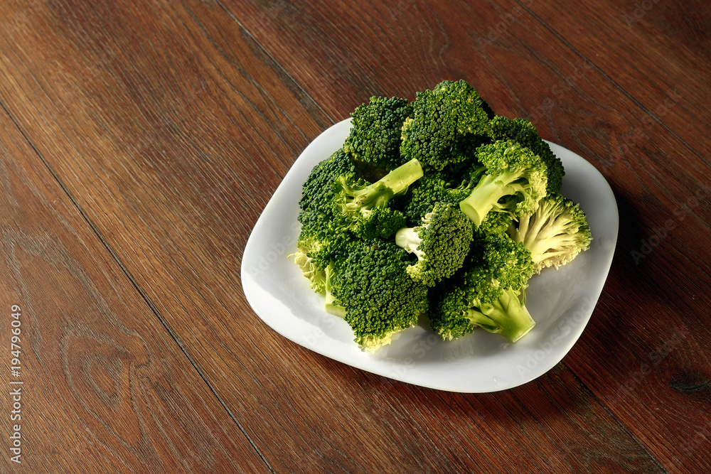 Healthy Green Organic Raw Broccoli Florets Ready for Cooking. The concept of healthy eating, detox. copy space Healthy Green Organic Raw Broccoli Florets Ready for Cooking. The concept of healthy eating, detox. copy space