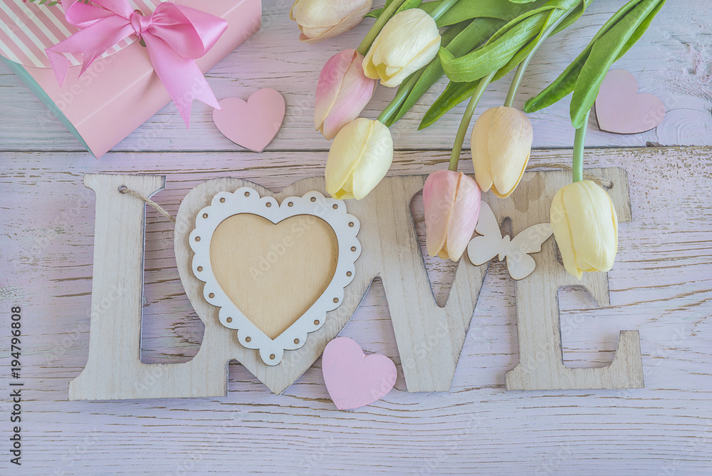 Holiday comporsition with pink gift box, tulips, letters Holiday comporsition with pink gift box, tulips, letters