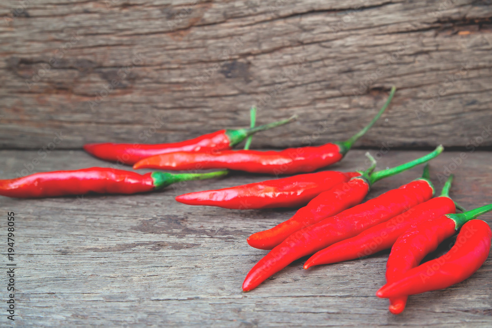 Hot red peppers on wooden table, Food ingredient Hot red peppers on wooden table, Food ingredient