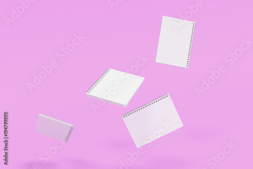 Four notebooks with spiral bound on violet background © GooD_WiN