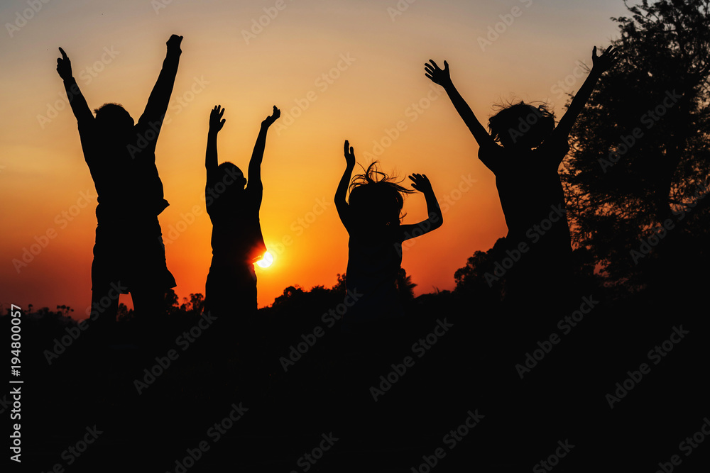 group people jumping silhouette with sunset