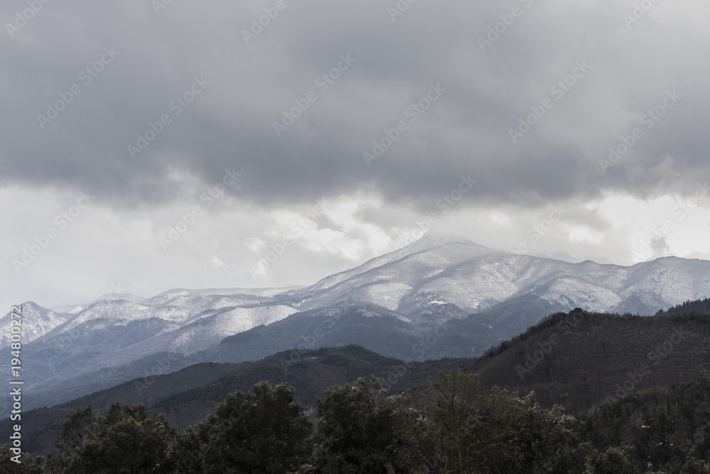 Stormy and cloudy weather mountain landscape
