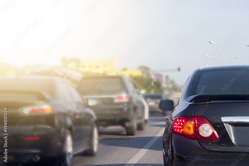 Cars stop on the road by traffic jam in rush hour on morning time.