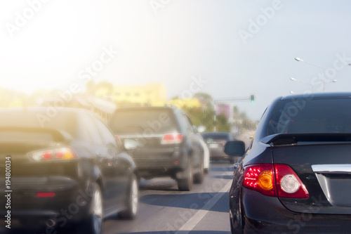 Cars stop on the road by traffic jam in rush hour on morning time.