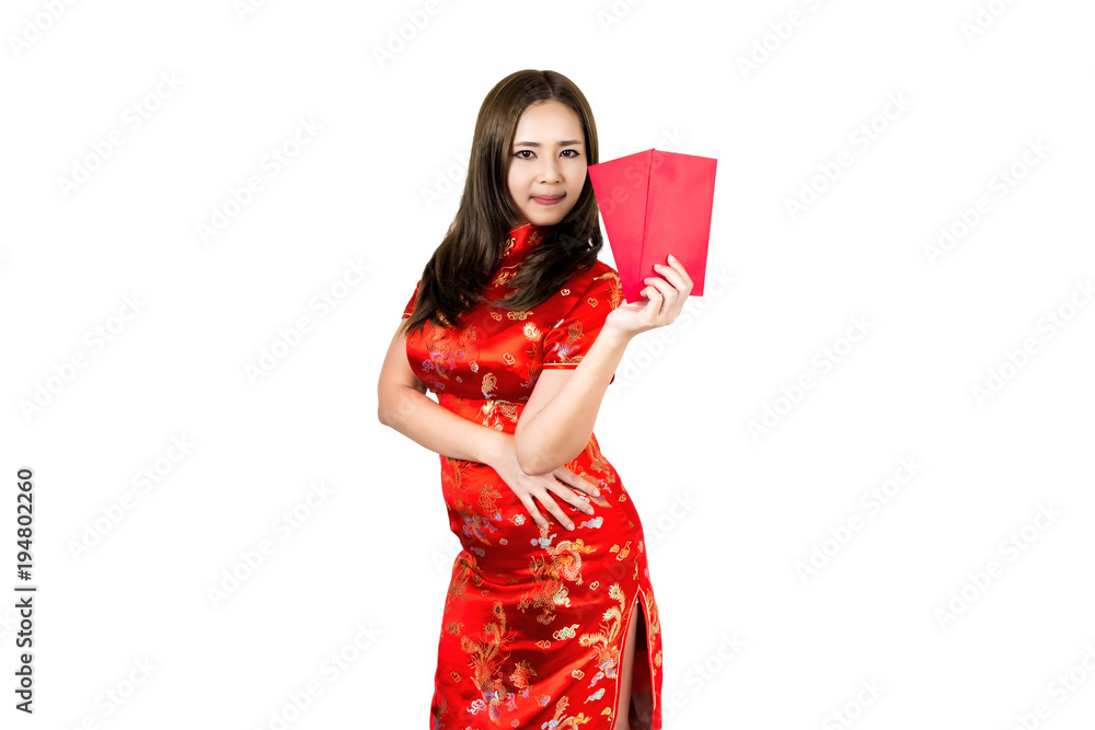 Beauty asian woman wearing cheongsam or qipao holding red envelopes and smiling in Happy Chinese New Year.