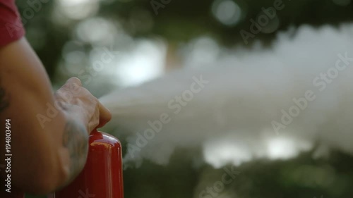 Person using a fire extinguisher, Ultra Slow Motion