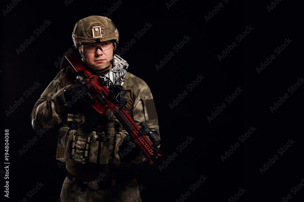 Picture of soldier in helmet with gun on empty black background Picture of soldier in helmet with gun on empty black background
