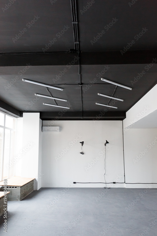 Black ceiling with LED lights in the office. Loft interior design Stock