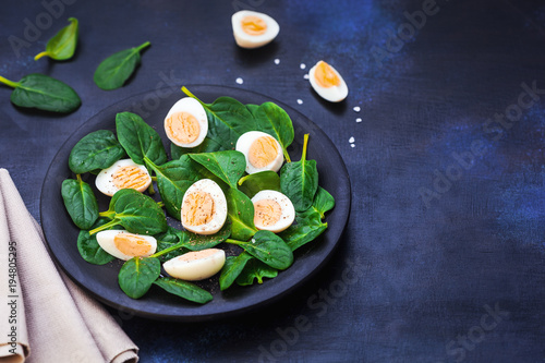 Fresh Green Spinach And Bolied Eggs photo