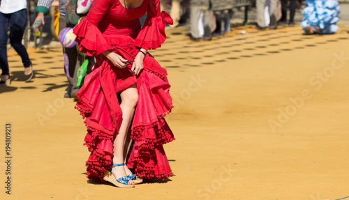 woman wearing traditional red flamenco dress