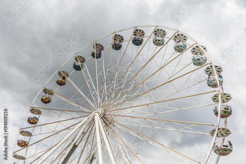 big ferris wheel with cloudy sky