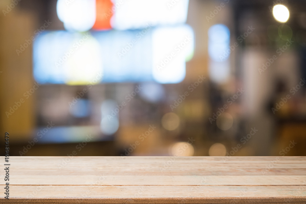 Empty wood table with night cafe blur background. Empty wood table with night cafe blur background.