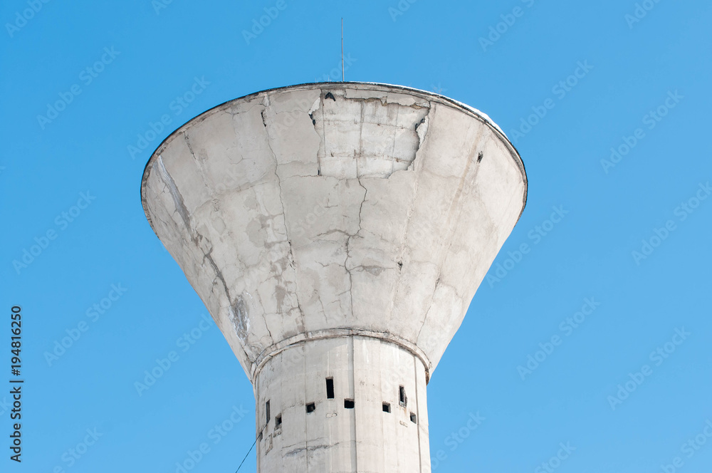 Old concrete tower close up shot on beautiful blue sky background. Old concrete tower close up shot on beautiful blue sky background.