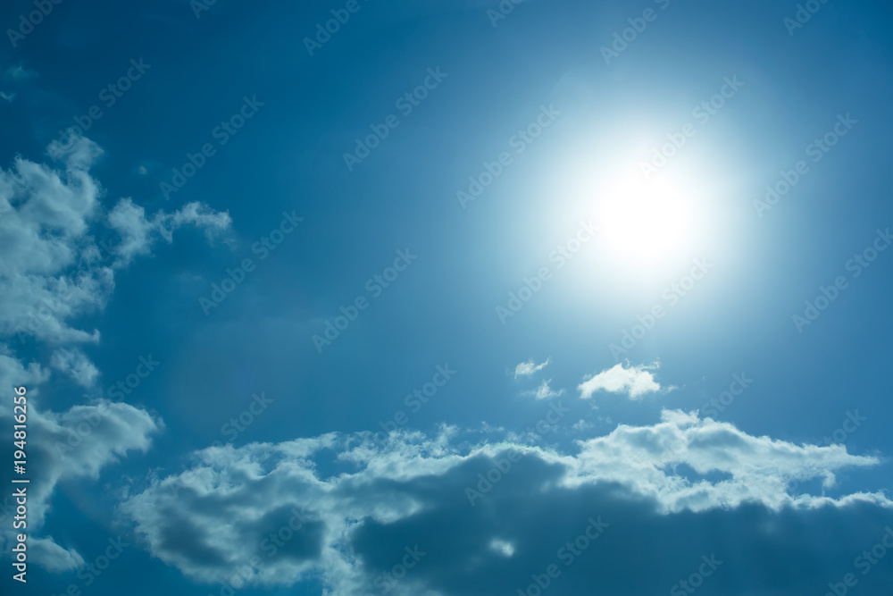 White sunlight rays on blue sky. White sunlight rays on blue sky.