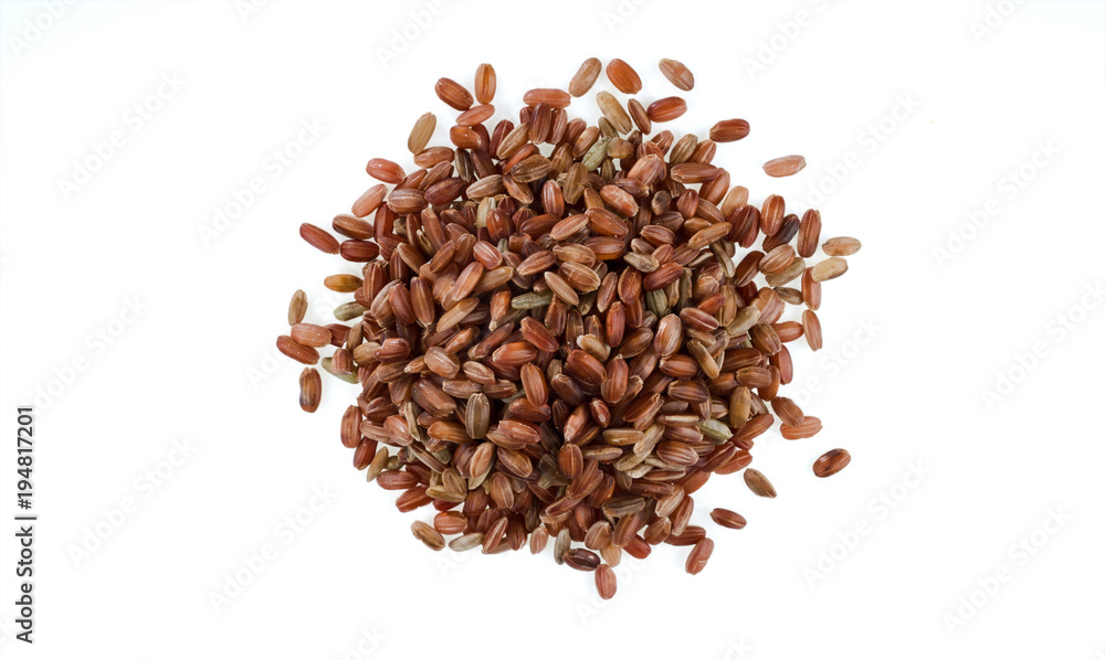 Handful of brown unpeeled rice isolated on white background. One of the varieties of rice. Handful of brown unpeeled rice isolated on white background. One of the varieties of rice.