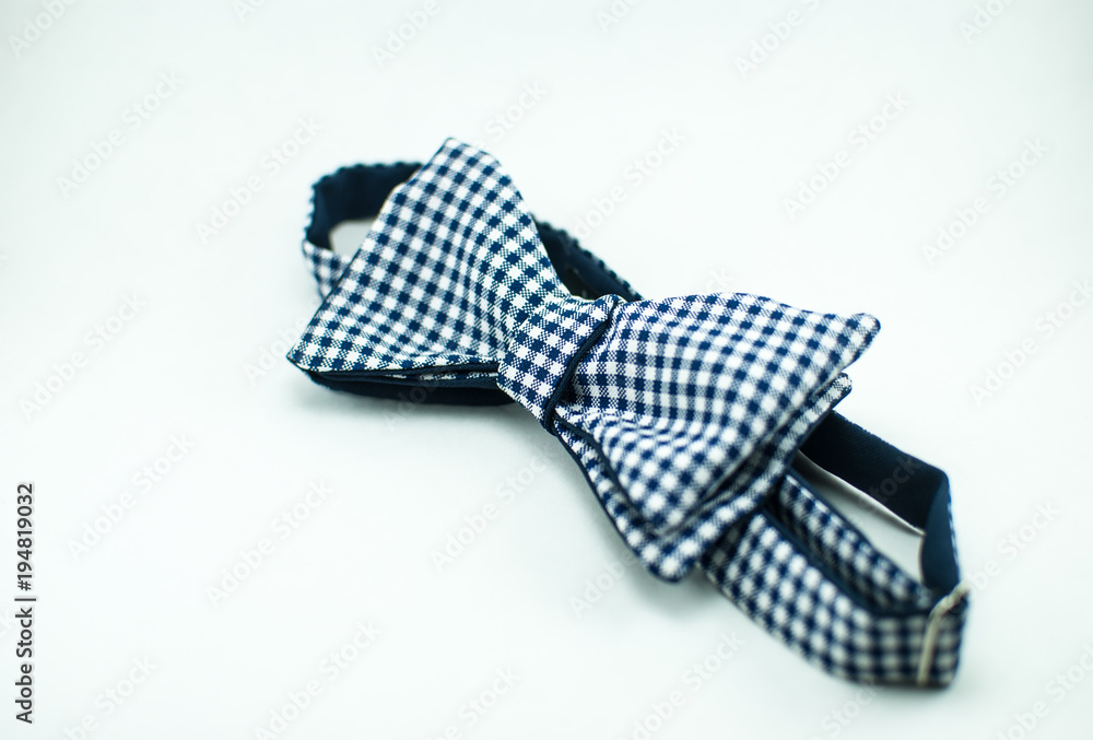 Stylish and well-designed white-black bow tie on a white background; isolated Stylish and well-designed white-black bow tie on a white background; isolated