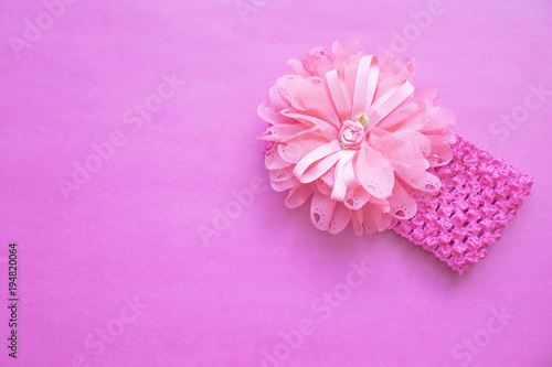 Fototapeta Naklejka Na Ścianę i Meble -  pink bezel with flower on pink background