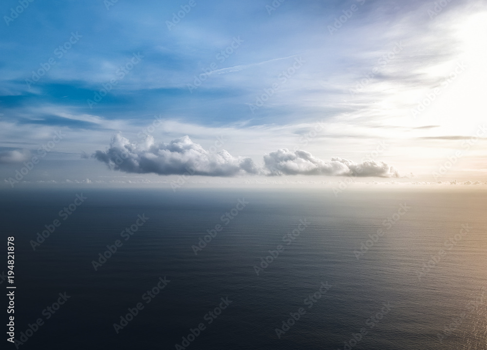 beautiful clouds over the sea at sunset .the view from the top