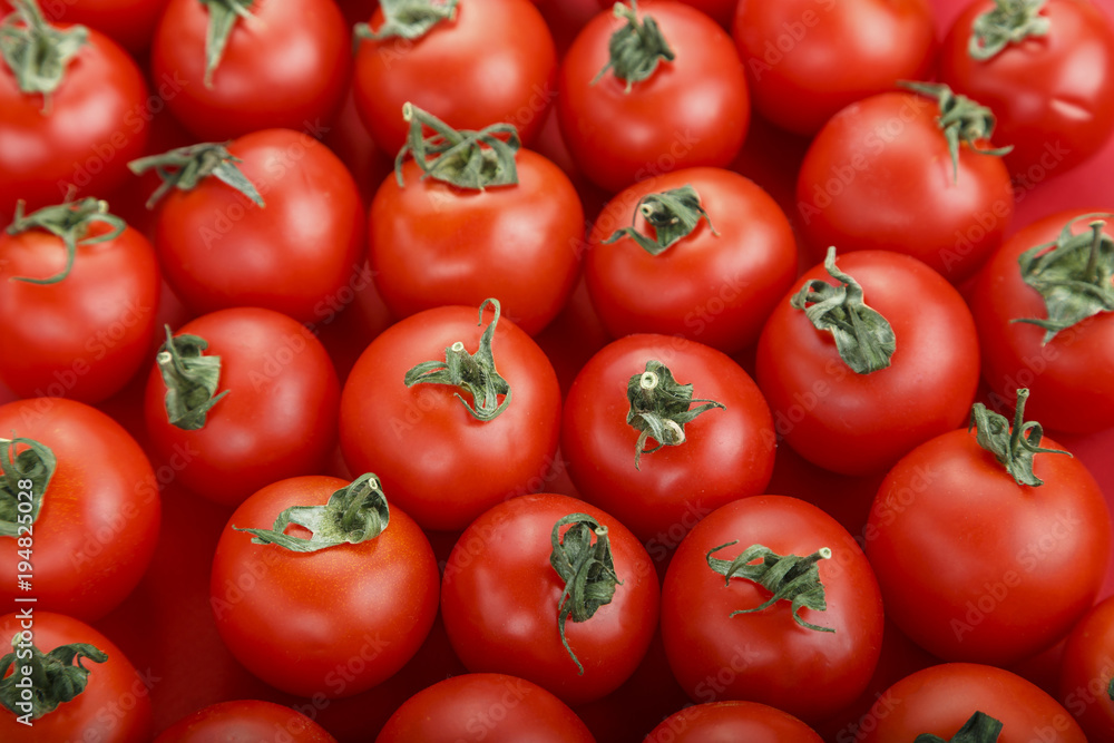 Fresh tomatoes. It can be used as background. (selective focus).Delicious red tomatoes. Fresh tomatoes. It can be used as background. (selective focus).Delicious red tomatoes.