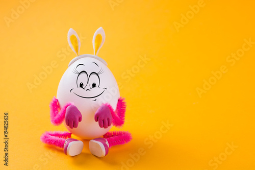 Funny Easter egg girl wearing bunny ears