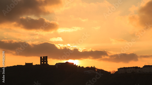 Silhouette of Scarborough Castle at sunrise in Winter.