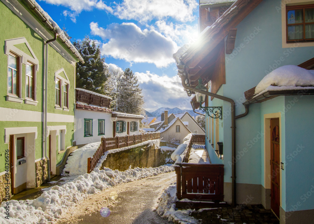 Winter street view, alpine village in winter sunny day