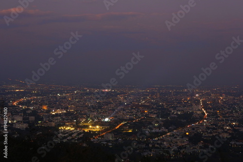 Chiang Mai city view at evening with sunbeam area highlight background, Thailand concept © Auttapon Moonsawad