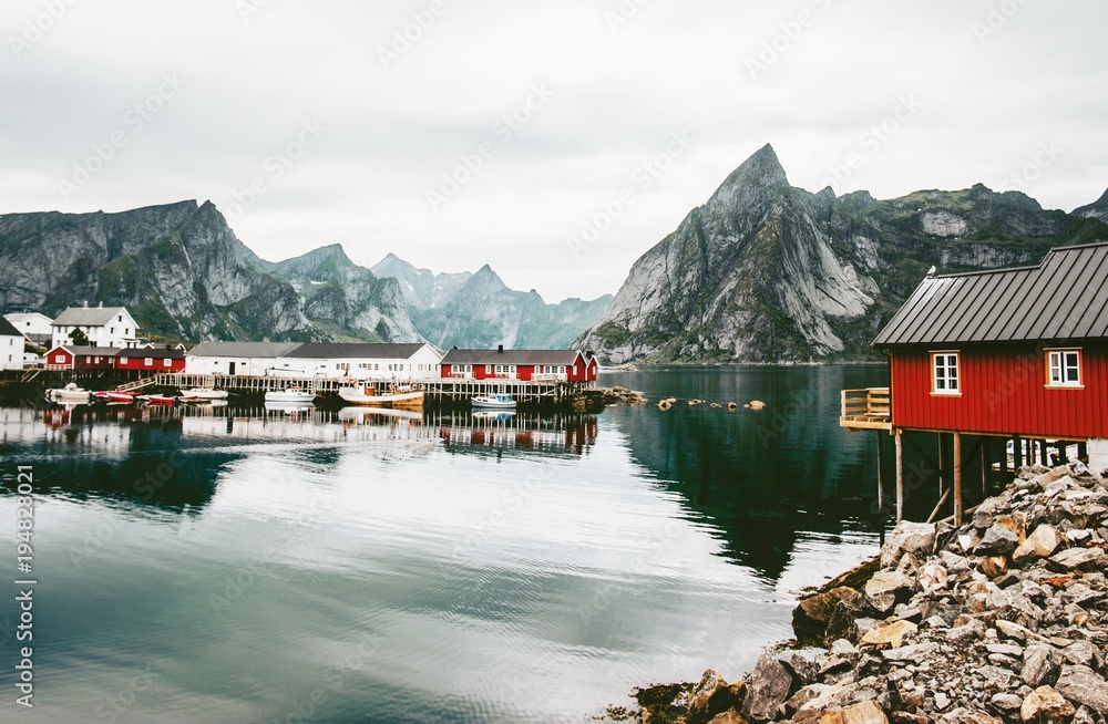 Norway rorbu houses and mountains rocks over fjord landscape scandinavian travel view Lofoten islands