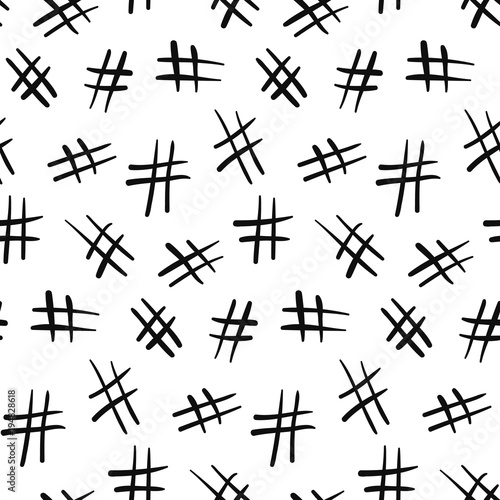 Seamless monochrome pattern with chaotic black doodle hashtag symbols on white background. Modern social media sign texture for textile, wrapping paper, cover, surface