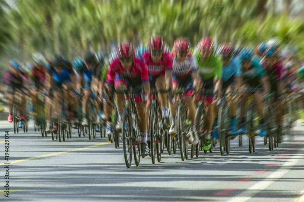 Obraz premium Competition cycling race on the road. Motion blur photo