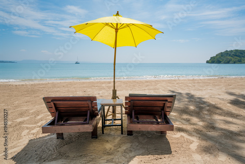 Fototapeta Naklejka Na Ścianę i Meble -  Beach Chairs and Umbrella on summer island in Phuket, Thailand. Summer, Travel, Vacation and Holiday concept.